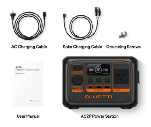 Bluetti AC2P Power Station with its control panel, accompanied by AC and solar charging cables, grounding screws, and user manual.