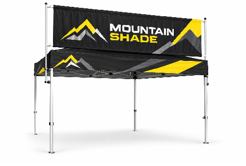 Black and yellow Mountain Shade branded canopy tent set up outdoors with logo and mountain graphic on valance, metal legs visible