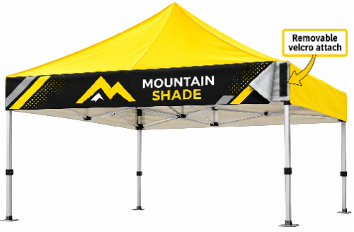 Yellow pop-up canopy tent with a black banner reading 'MOUNTAIN SHADE' and a label noting removable velcro attachment.